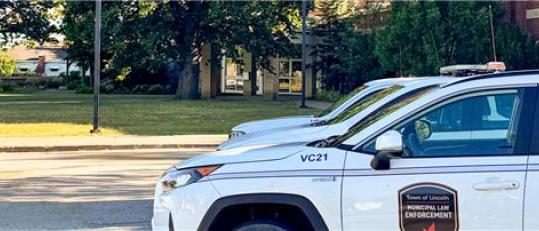 Copped image of cars parked.